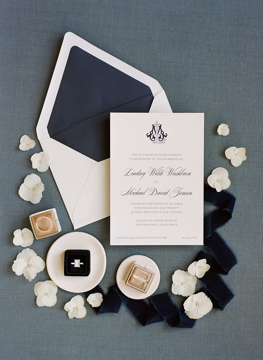 custom invitations for legion of honor wedding with navy envelope liner and monogram